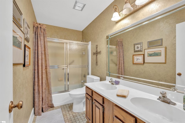122 Tanager Cir, Greer, SC 29650 - bathroom with toilet, bath / shower combo with glass door, double vanity, tile patterned flooring, and a textured wall