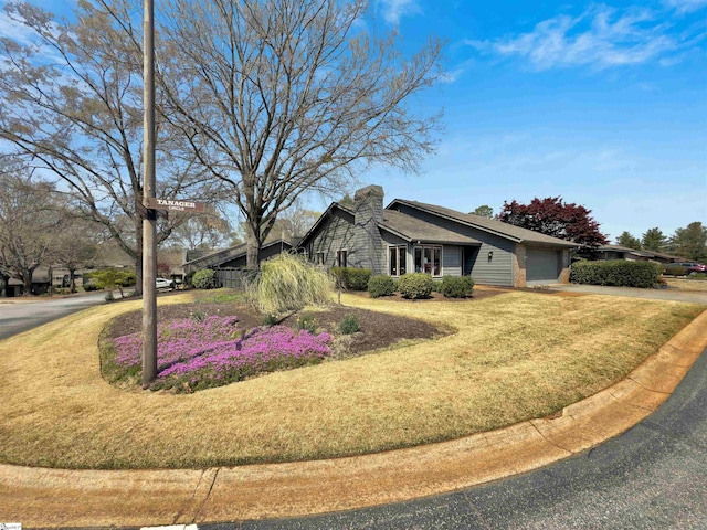 122 Tanager Cir, Greer, SC 29650 - view of front facade with an attached garage, driveway, a front lawn, and brick siding