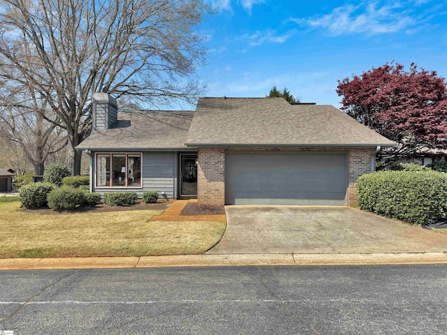 122 Tanager Cir, Greer, SC 29650 - view of front of home featuring a chimney, a garage, brick siding, and a front lawn