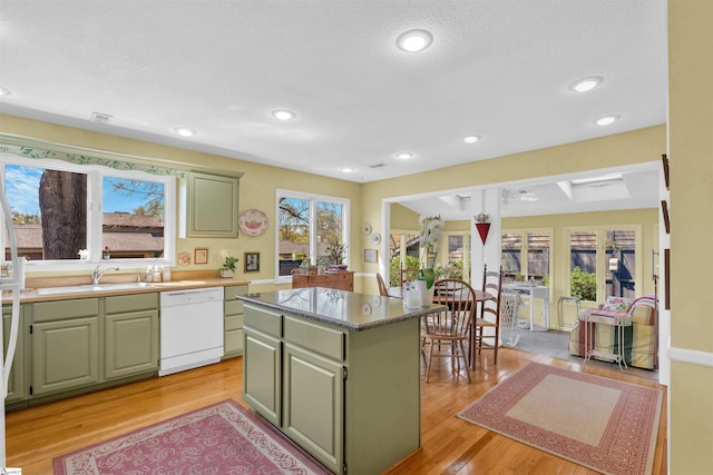 122 Tanager Cir, Greer, SC 29650 - kitchen featuring green cabinetry, dishwasher, a center island, light wood-type flooring, and recessed lighting
