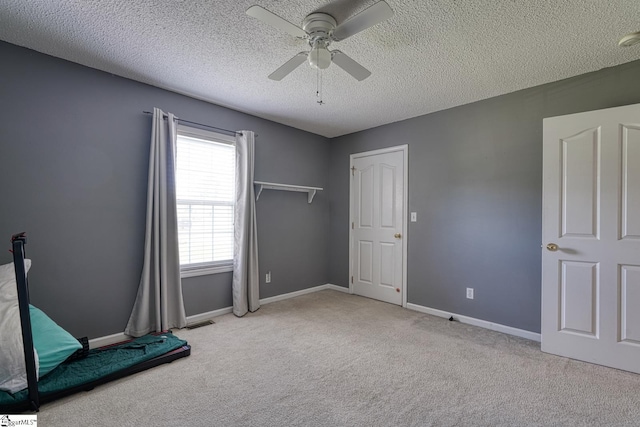 103 Cheyenne Ridge Rd, Campobello, SC 29322 - unfurnished bedroom featuring carpet flooring, a textured ceiling, baseboards, and ceiling fan