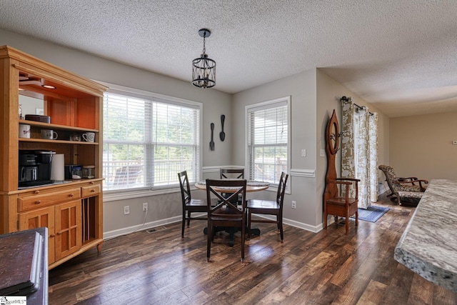 103 Cheyenne Ridge Rd, Campobello, SC 29322 - dining area featuring dark wood-style flooring, a textured ceiling, plenty of natural light, and a chandelier