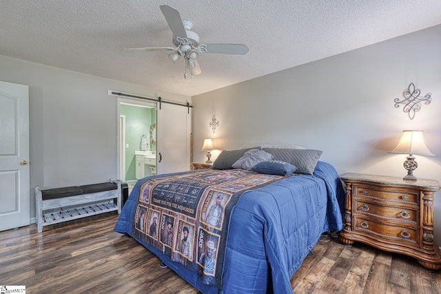 103 Cheyenne Ridge Rd, Campobello, SC 29322 - bedroom featuring wood finished floors, a barn door, a textured ceiling, ceiling fan, and ensuite bathroom