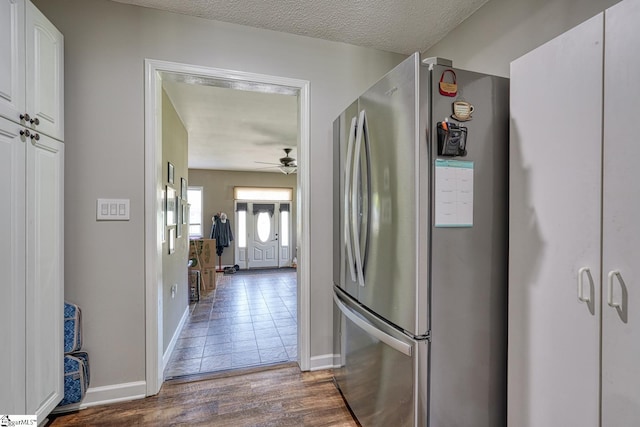 103 Cheyenne Ridge Rd, Campobello, SC 29322 - kitchen featuring freestanding refrigerator, white cabinets, wood finished floors, a ceiling fan, and baseboards