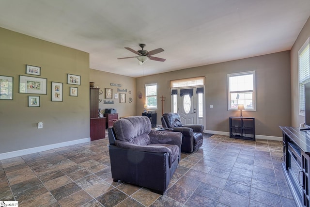103 Cheyenne Ridge Rd, Campobello, SC 29322 - living area with stone tile floors, baseboards, and a ceiling fan
