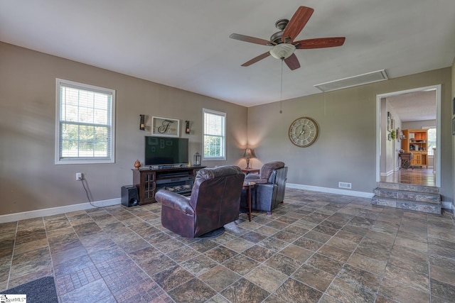 103 Cheyenne Ridge Rd, Campobello, SC 29322 - living area featuring attic access, stone tile floors, baseboards, and ceiling fan