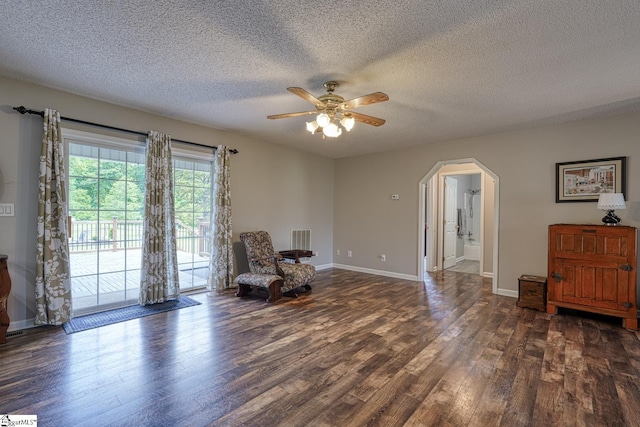 103 Cheyenne Ridge Rd, Campobello, SC 29322 - sitting room featuring arched walkways, wood finished floors, a ceiling fan, a textured ceiling, and baseboards