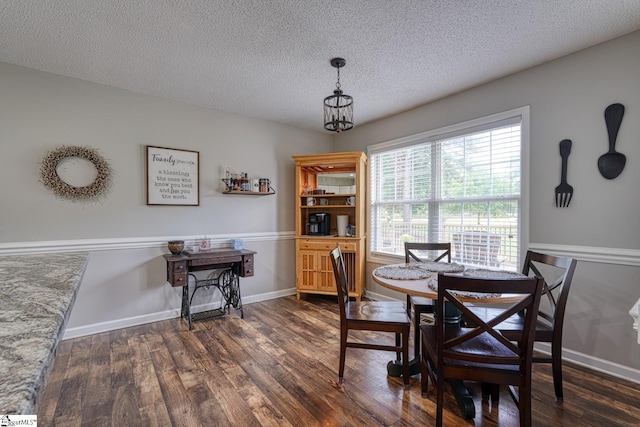 103 Cheyenne Ridge Rd, Campobello, SC 29322 - dining room with dark wood finished floors, a textured ceiling, baseboards, and a chandelier