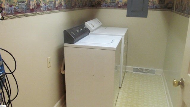 320 N Adair St, Clinton, SC 29325 - laundry area with electric panel, separate washer and dryer, tile patterned floors, and baseboards
