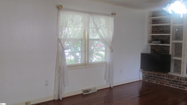 320 N Adair St, Clinton, SC 29325 - unfurnished living room with wood finished floors