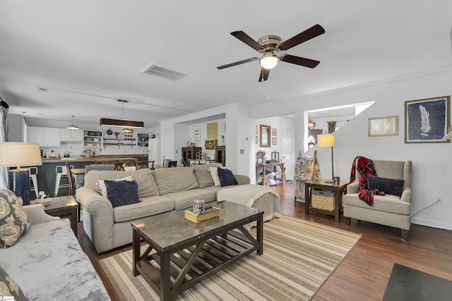 157 Stonewood Crossing Dr, Boiling Springs, SC 29316 - living area with wood finished floors, ceiling fan, baseboards, and crown molding