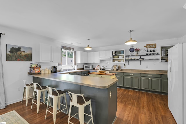 157 Stonewood Crossing Dr, Boiling Springs, SC 29316 - kitchen featuring white appliances, a peninsula, open shelves, dark wood-style floors, and a sink