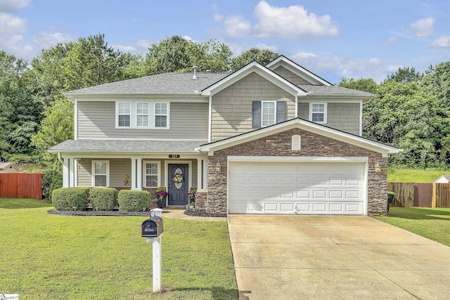 157 Stonewood Crossing Dr, Boiling Springs, SC 29316 - view of front of property featuring stone siding, driveway, a garage, covered porch, and roof with shingles