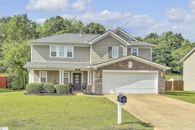 157 Stonewood Crossing Dr, Boiling Springs, SC 29316 - view of front of house featuring driveway, stone siding, roof with shingles, and covered porch