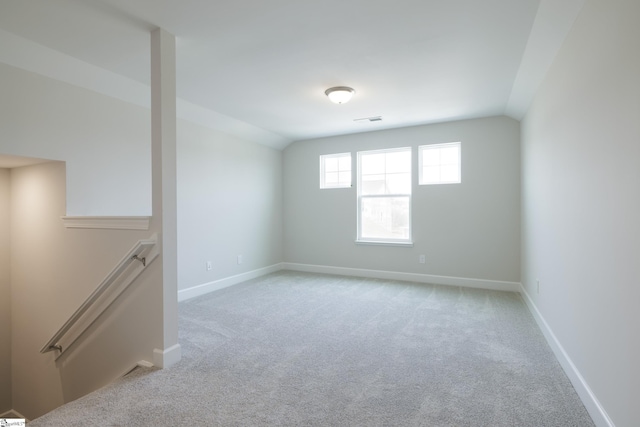 207 Fenner Pl, Greenville, SC 29607 - unfurnished room with light carpet, baseboards, and vaulted ceiling
