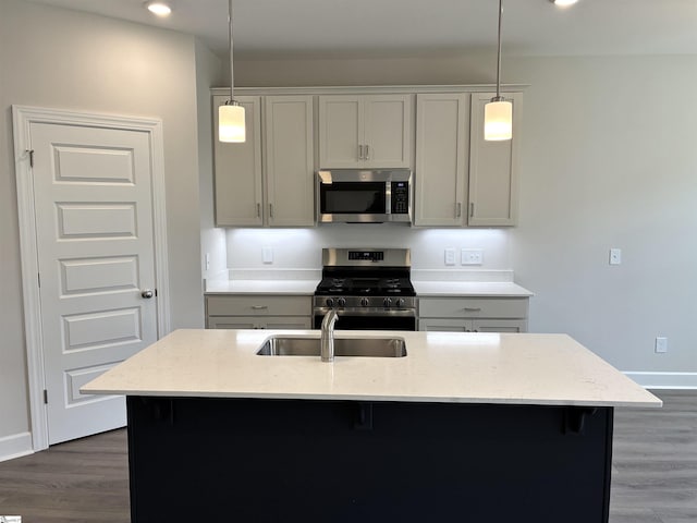 207 Fenner Pl, Greenville, SC 29607 - kitchen featuring stainless steel appliances, light stone counters, dark wood-style flooring, hanging light fixtures, and recessed lighting