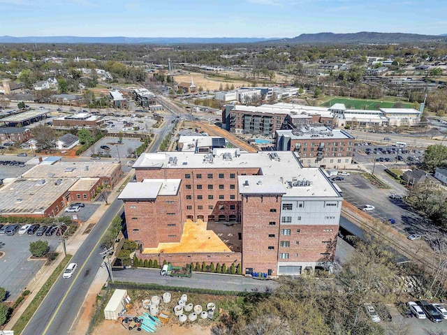 aerial view of property's location featuring mountains