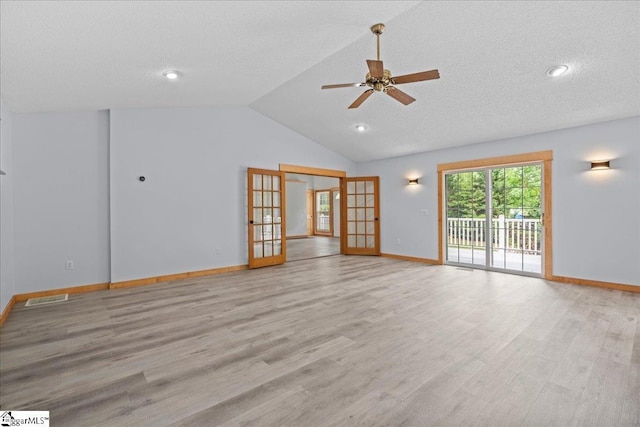 150 Orchard Dr, Inman, SC 29349 - unfurnished living room with french doors, light wood-type flooring, a ceiling fan, baseboards, and vaulted ceiling