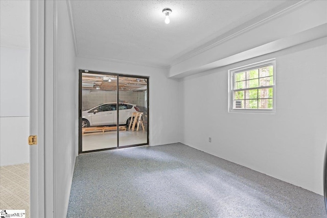 150 Orchard Dr, Inman, SC 29349 - spare room with a textured ceiling, speckled floor, and crown molding