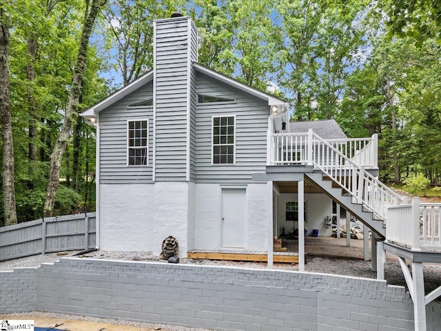 150 Orchard Dr, Inman, SC 29349 - back of property featuring a wooden deck, stairway, a chimney, and fence