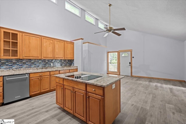 150 Orchard Dr, Inman, SC 29349 - kitchen with stainless steel dishwasher, black electric stovetop, high vaulted ceiling, decorative backsplash, and light wood-type flooring