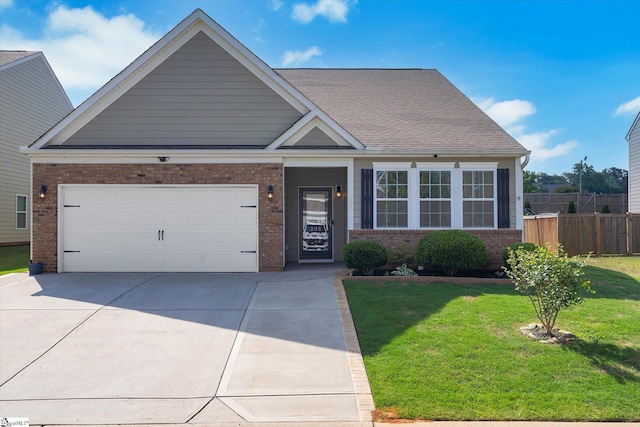 205 Hartwood Lake Ln, Greer, SC 29650 - view of front facade with brick siding, concrete driveway, and a garage