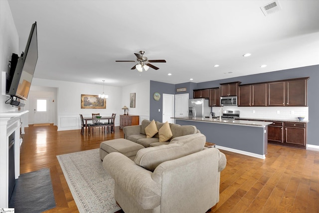 205 Hartwood Lake Ln, Greer, SC 29650 - living room featuring a ceiling fan, light wood finished floors, recessed lighting, a chandelier, and baseboards