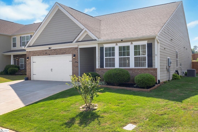 205 Hartwood Lake Ln, Greer, SC 29650 - view of front facade featuring brick siding, concrete driveway, central air condition unit, a front lawn, and an attached garage