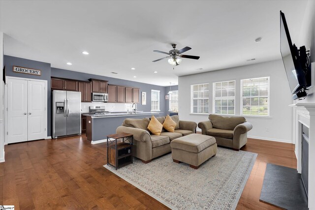 205 Hartwood Lake Ln, Greer, SC 29650 - living room with a ceiling fan, recessed lighting, dark wood-type flooring, baseboards, and a fireplace with flush hearth