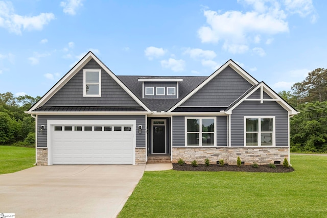1047 Ansel School Rd, Greer, SC 29651 - craftsman-style home with stone siding, concrete driveway, a front yard, a standing seam roof, and a shingled roof