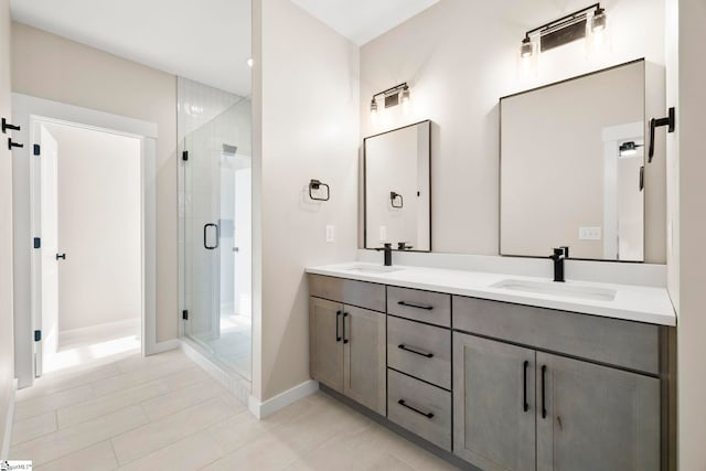 1047 Ansel School Rd, Greer, SC 29651 - bathroom featuring a shower stall, baseboards, double vanity, and tile patterned floors