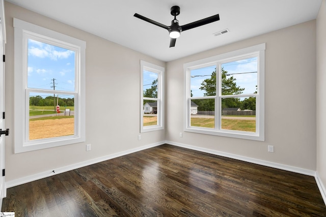 1047 Ansel School Rd, Greer, SC 29651 - unfurnished room with dark wood-style floors, a ceiling fan, and baseboards