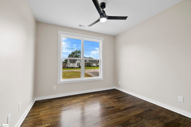 1047 Ansel School Rd, Greer, SC 29651 - spare room featuring dark wood-style flooring, ceiling fan, and baseboards