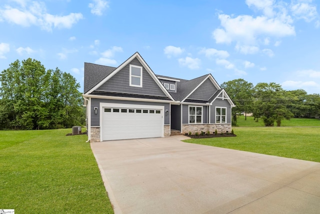1047 Ansel School Rd, Greer, SC 29651 - craftsman-style house featuring stone siding, concrete driveway, a garage, and a front lawn