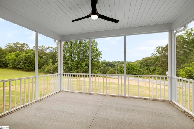 1047 Ansel School Rd, Greer, SC 29651 - unfurnished sunroom featuring ceiling fan, view of wooded area, and healthy amount of natural light