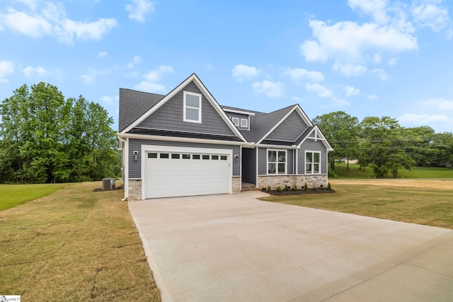 1047 Ansel School Rd, Greer, SC 29651 - craftsman house with stone siding, concrete driveway, a garage, and a front yard