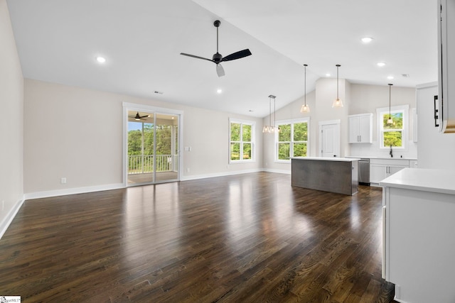 1047 Ansel School Rd, Greer, SC 29651 - unfurnished living room with ceiling fan, a sink, dark wood-style flooring, high vaulted ceiling, and baseboards