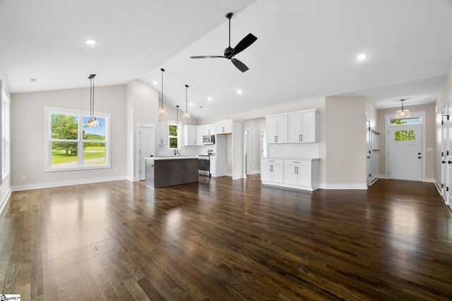 1047 Ansel School Rd, Greer, SC 29651 - unfurnished living room with ceiling fan, dark wood finished floors, baseboards, recessed lighting, and high vaulted ceiling