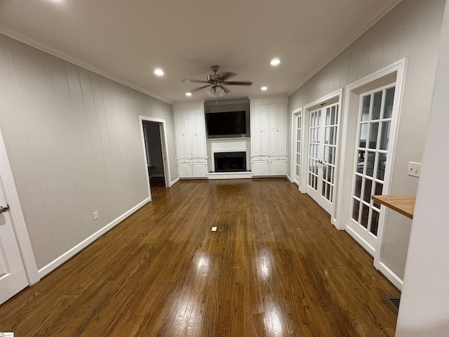 102 Quail Creek Ln, Greenville, SC 29615 - unfurnished living room featuring crown molding, dark wood finished floors, a fireplace with raised hearth, ceiling fan, and recessed lighting