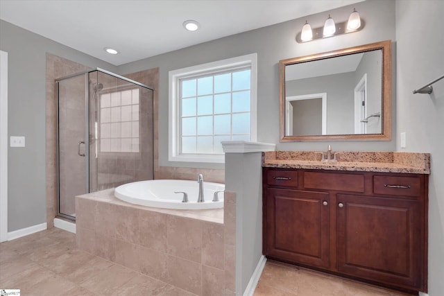 606 N Meadows Ln, Easley, SC 29642 - full bathroom featuring a shower stall, tile patterned floors, vanity, a bath, and baseboards
