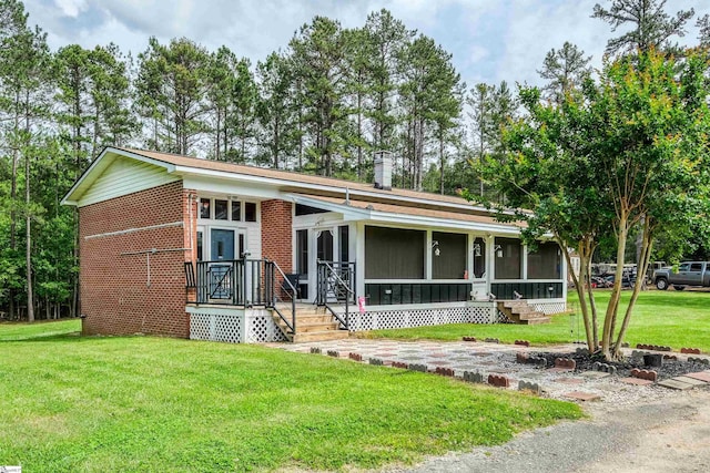 402 Terrapin Rd, Union, SC 29379 - view of front facade with a front yard, a sunroom, and brick siding