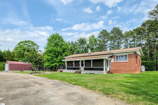 402 Terrapin Rd, Union, SC 29379 - view of front of property featuring brick siding, entry steps, a sunroom, and a front yard