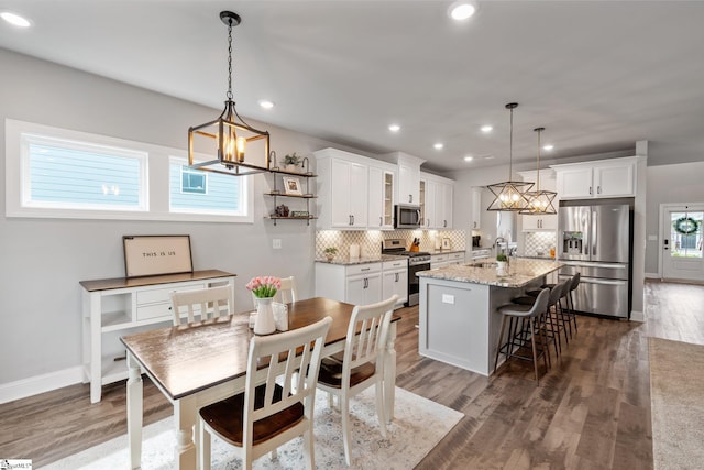 907 Whitemarsh Ave, Simpsonville, SC 29680 - kitchen featuring stainless steel appliances, a sink, a chandelier, backsplash, and recessed lighting