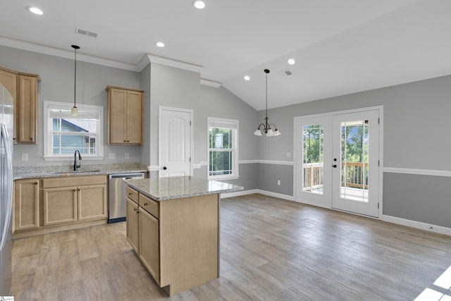 kitchen with stainless steel appliances, a sink, light stone countertops, light wood-style floors, and recessed lighting