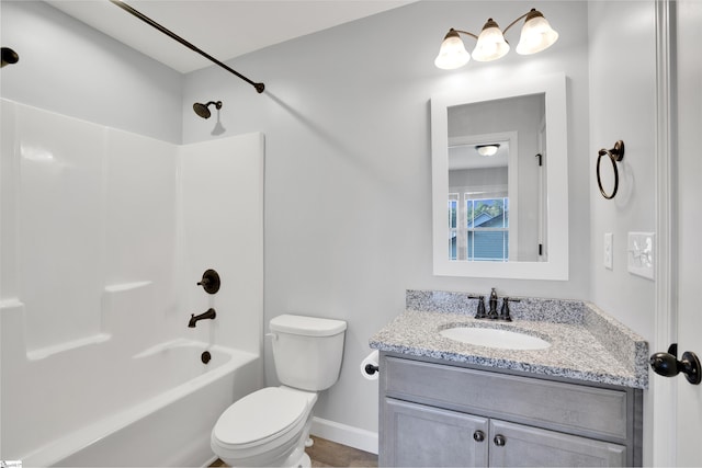 full bathroom with toilet, vanity, shower / tub combination, and baseboards