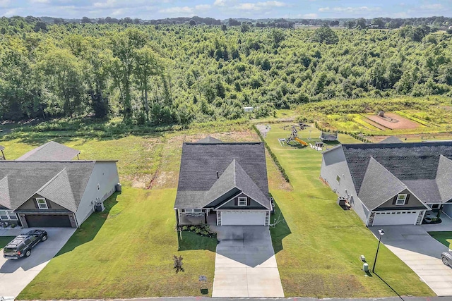 view of subject property with a forest
