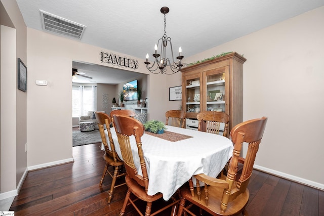 113 Faulkner Cir, Greer, SC 29651 - dining room with a chandelier, dark wood-type flooring, baseboards, and ceiling fan