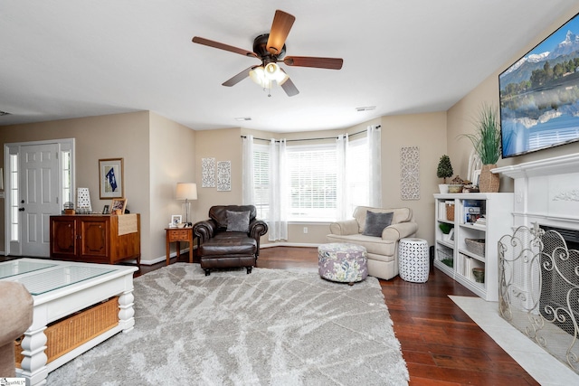113 Faulkner Cir, Greer, SC 29651 - living room with wood finished floors, a ceiling fan, baseboards, and a fireplace with flush hearth