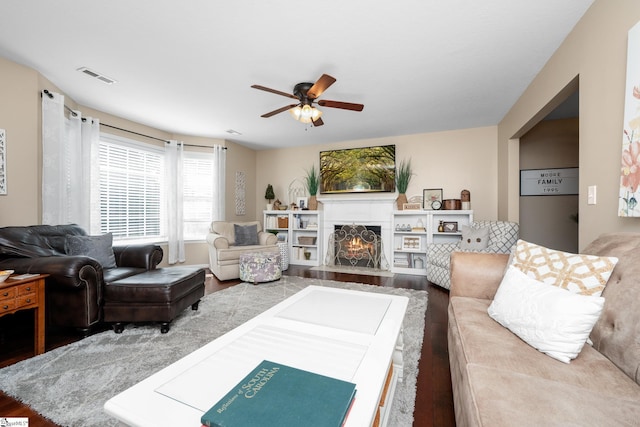 113 Faulkner Cir, Greer, SC 29651 - living room with wood finished floors, ceiling fan, and a lit fireplace