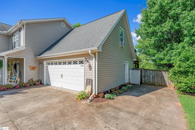 113 Faulkner Cir, Greer, SC 29651 - view of side of property with concrete driveway, a garage, and roof with shingles